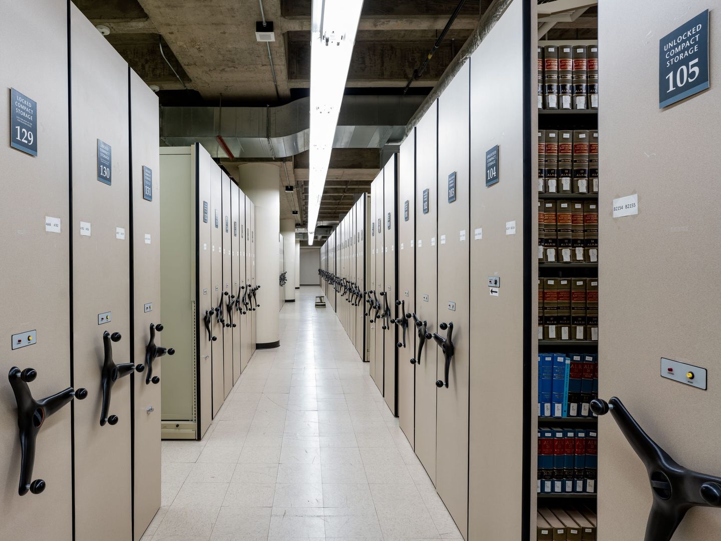 Rows of law reports on library shelves